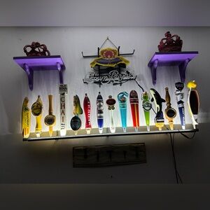 15 vintage beer tap handles with light up shelf